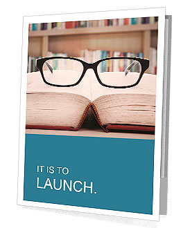 Closeup of reading glasses on the book. shot in the library Presentation Folder