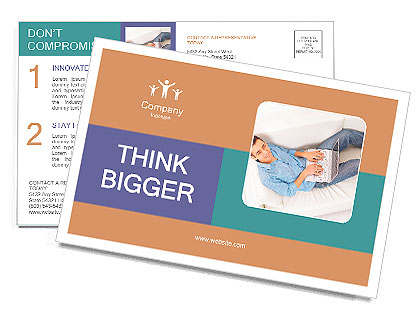 Portrait of a man relaxing on couch while using a laptop Postcard Template