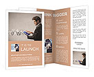 Young businessman working on a tablet Brochure Template