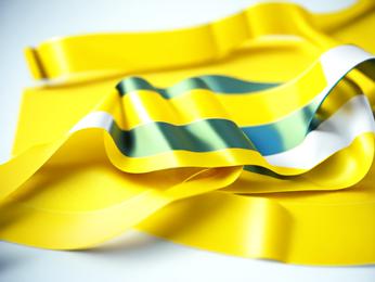 A close up of a yellow ribbon on a white background PowerPoint Template