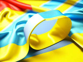 A close up of a yellow, blue, and red fabric PowerPoint Template