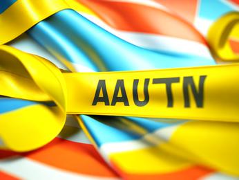 A close up of a yellow ribbon with a name on it PowerPoint Template