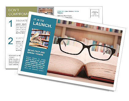 Closeup of reading glasses on the book. shot in the library Postcard Template