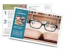 Closeup of reading glasses on the book. shot in the library Postcard Template