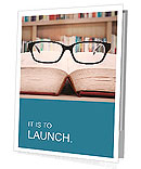 Closeup of reading glasses on the book. shot in the library Presentation Folder