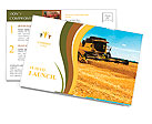 Combine harvester on a wheat field with a blue sky Postcard Template