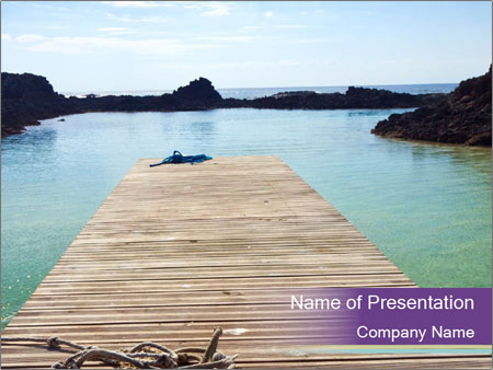 Deserted Jetty At Los Lobos Lagoon: A Remote Island Close To Fuerteventura Google Slides Theme